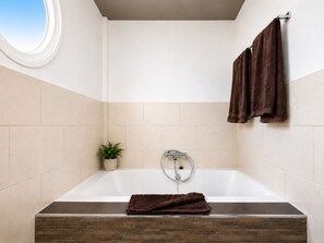 Bathtub, hair dryer, bidet, towels