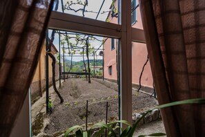 Enjoy a serene view of the lush garden from the comfort of your room.
