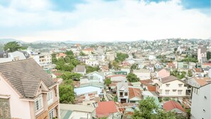 A densely packed urban area with various buildings, including residential and commercial structures.