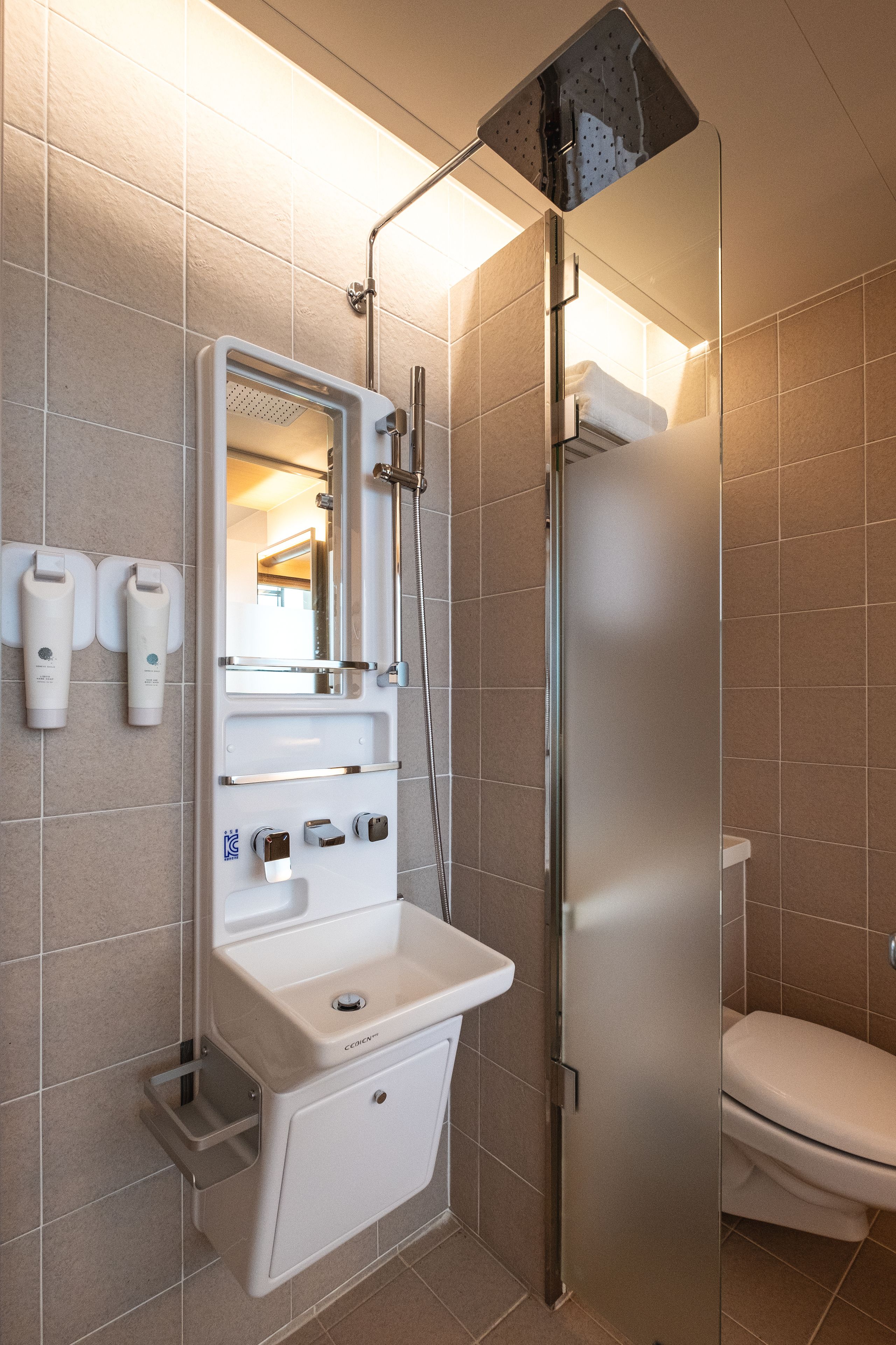 shower, hair dryer, slippers, towels