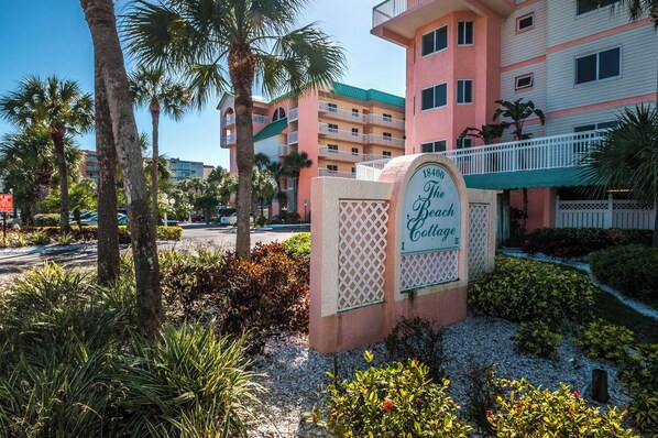 A multi-story building with a sign reading "The Beach Cottage." - PICTURE PERFECT!  3 balconies! BC #2406 (Indian Shores)