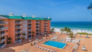 A hotel with multiple balconies, a swimming pool, and a beach view. - PICTURE PERFECT!  3 balconies! BC #2406 (Indian Shores)