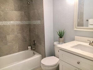 Combined shower/bathtub, hair dryer, towels, soap