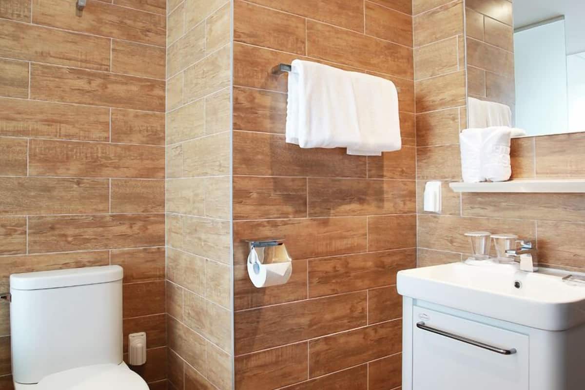 shower, hair dryer, bathrobes, towels