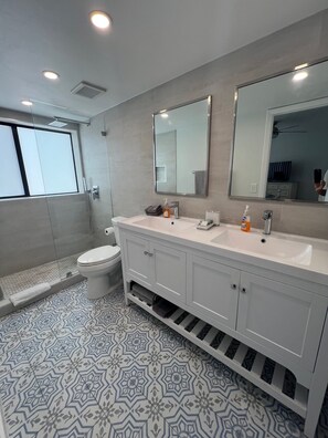 Bathtub, hair dryer, towels, soap