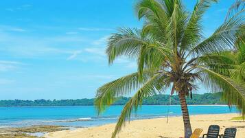 On the beach, sun loungers, beach towels