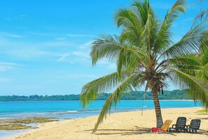 On the beach, sun loungers, beach towels