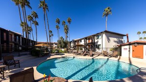 A swimming pool surrounded by palm trees and outdoor seating. - 215 Park Views, King Size Bed, Putting Green, Pickleball & More (Scottsdale)