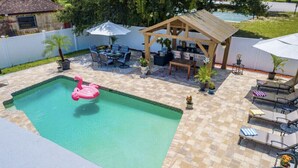 Outdoor pool, a heated pool - PERFECT GETAWAY FOR FAMILY REUNIONS ,  WEDDINGS, ESPORTS TEAMS! HEATED POOL! (Fort Myers)