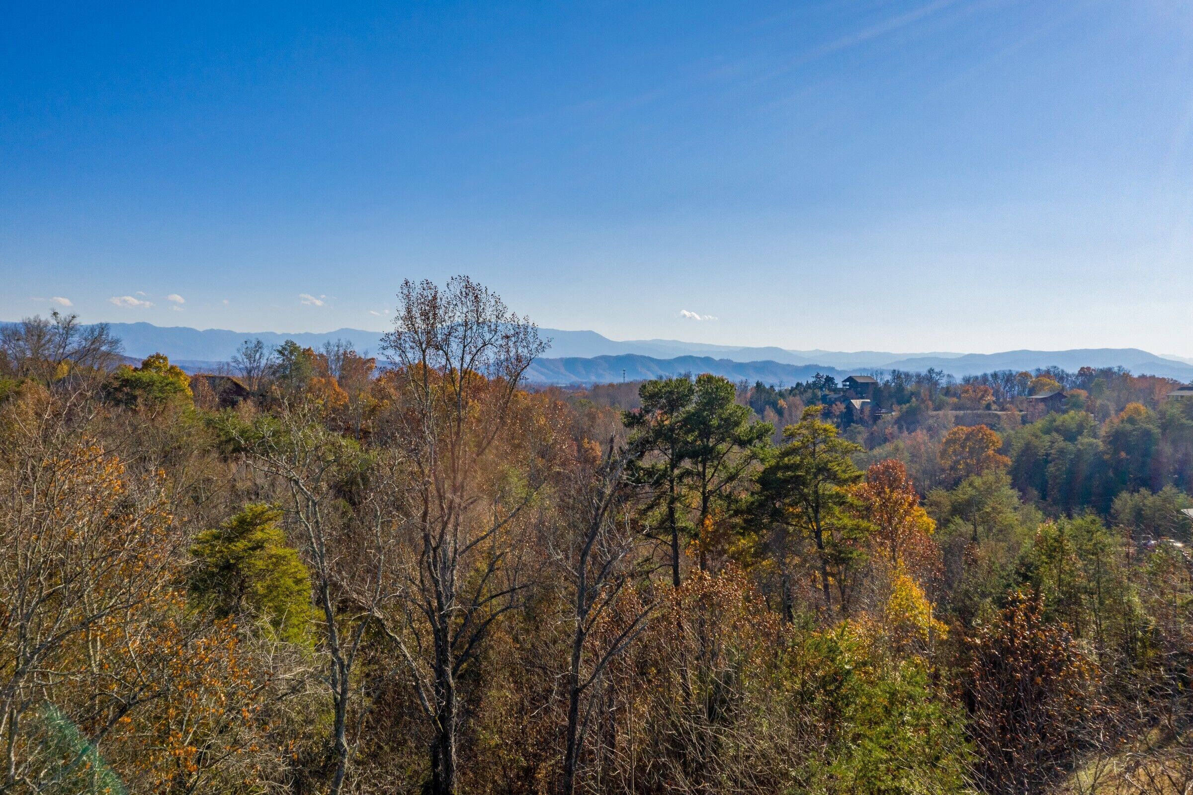 A mountainous landscape with autumn foliage.