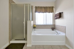 Combined shower/tub, hair dryer, towels, soap