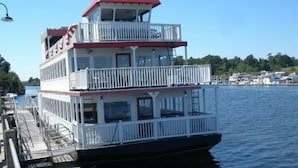 A multi-deck riverboat with a white exterior and red accents, docked at a pier. - Jeffscondos --- Ocean Blue Resort - Ocean Front vacation rental 5bed / 4bath (Myrtle Beach)