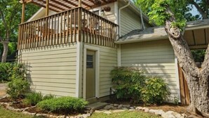 A single-story house with a covered porch and a small front yard. - Spacious 2 Bedroom in Historic Hyde Park (Austin)