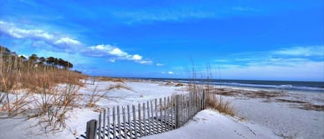 Enjoy a serene coastal escape with access to a wide, open beach.
