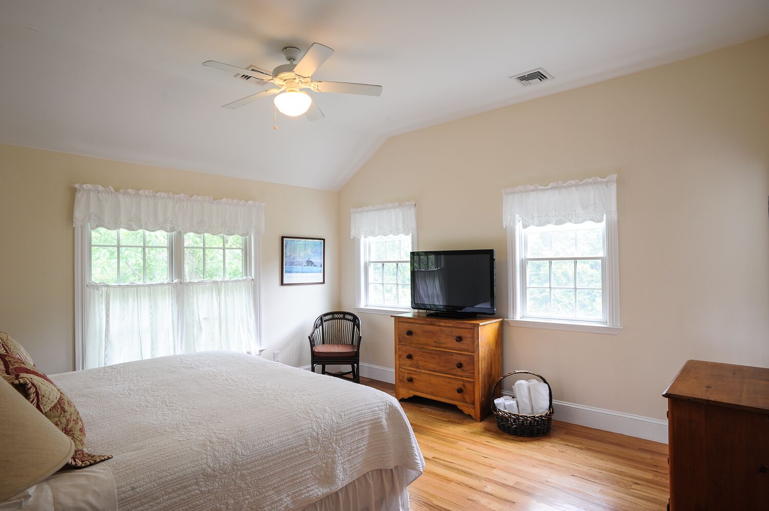 Master suite with 10' ceilings, flat-screen TV, and private marble bath.