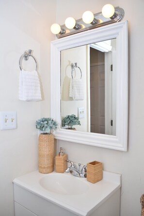 Shower, hair dryer, towels, shampoo