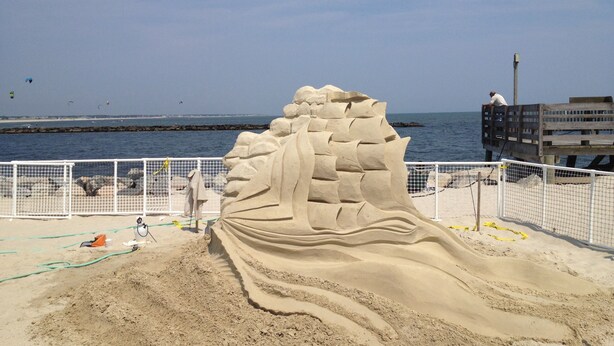 A sandy beach with a large sand sculpture of a dragon. - Quaint Cape Cod Cottage close to all nantucket sound beaches, and RT28 Fun  (South Yarmouth)