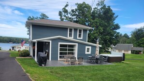 A two-story house with a deck, outdoor seating, and a hot tub. - 5 minutes to Peek n Peak, ON SITE PRIVATE HOT TUB, Large private yard (Clymer)