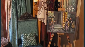 A room with a chair, a painting, and a lamp. - Beautiful 5 rm.Hardwood Austin Home! (Austin)