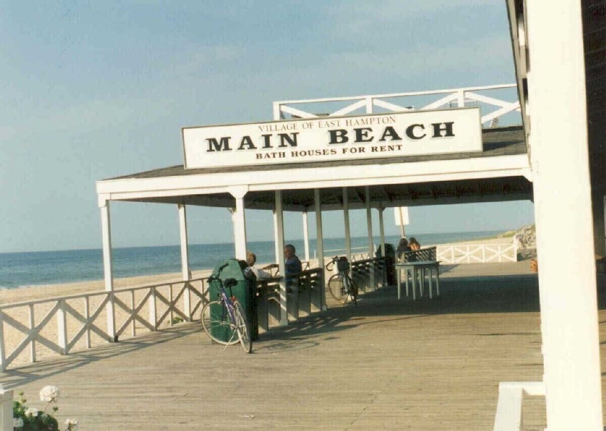 A covered area with a sign reading "Main Beach Bath Houses for Rent" in the Village of East Hampton.
