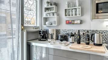 Espresso maker, coffee/tea maker, fridge, microwave