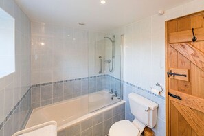 Bathtub, hair dryer, towels, soap