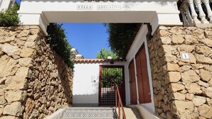 A stone wall entrance to a building labeled "Residencial Villa Adelinda." - Apartment in private urbanization with pool and garden area in Santa Pola (Santa Pola)