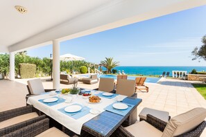 Outdoor dining - Luxury Oceanfront Villa with breathtaking Sea Views, heated (opt.) infinity Pool (Luz)