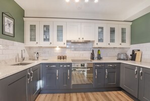 Fridge, oven, toaster, cookware/dishes/utensils