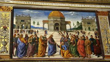 A fresco mural with architectural elements and figures.