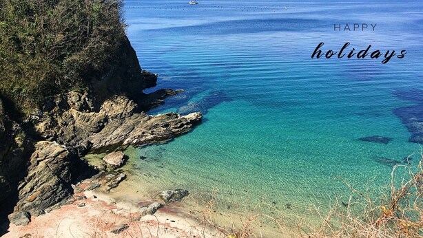 A coastal landscape with clear blue waters, rocky cliffs, and sparse vegetation. - Villa Métisse with neat decoration and great comfort (Groix)
