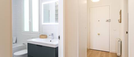 Bathtub, hair dryer, towels