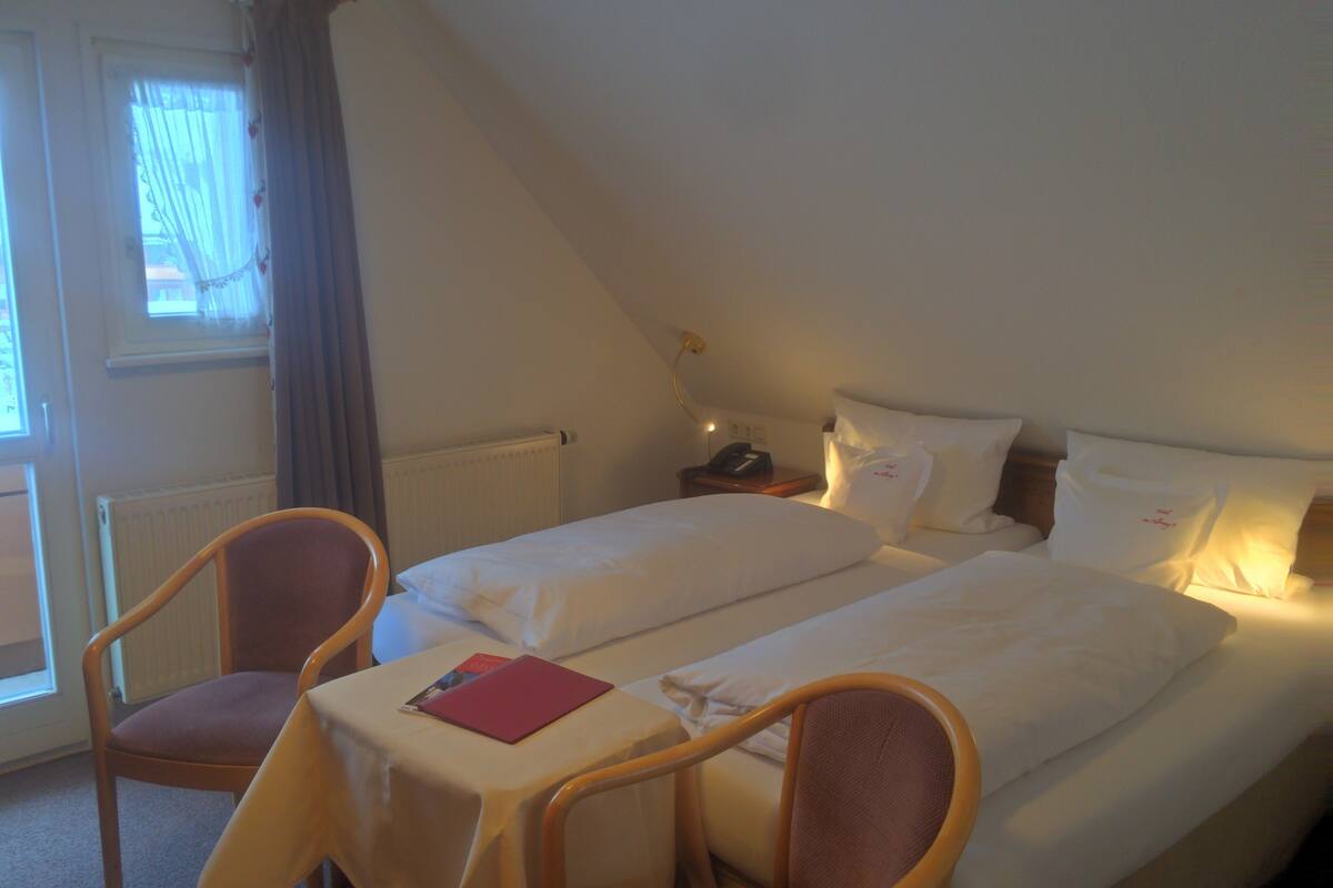 double room, balcony | in-room safe, desk, blackout curtains, rollaway beds