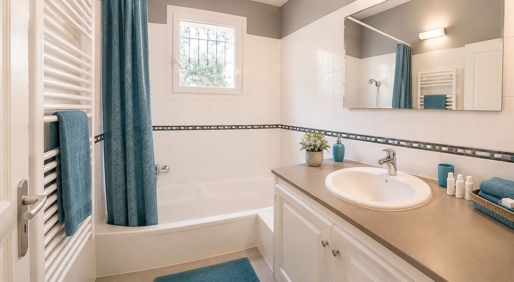 A bathroom with a bathtub, a sink, a mirror, and a window.