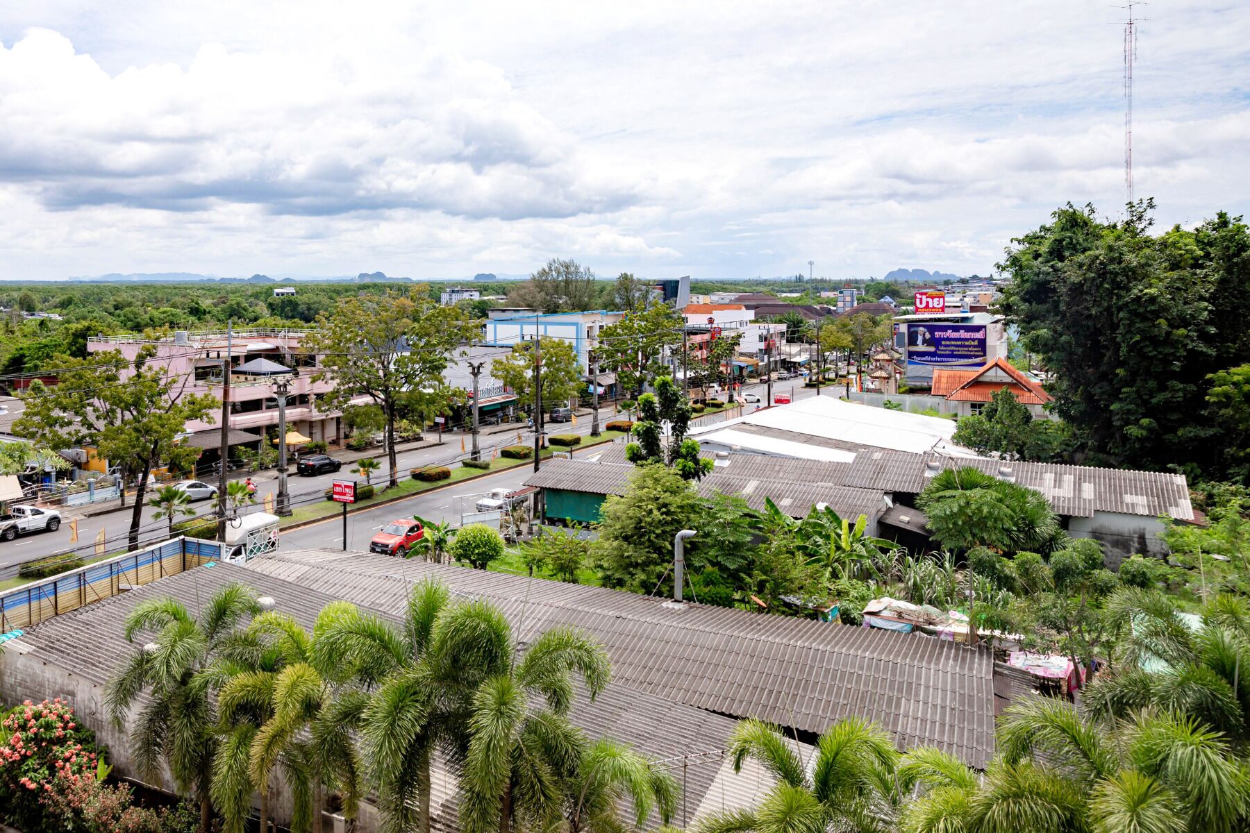 A cityscape with buildings, roads, and greenery.