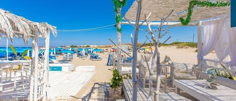 On the beach, sun loungers