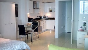 Enjoy a stylish stay in this apartment with a dining area, kitchenette, and separate living space.