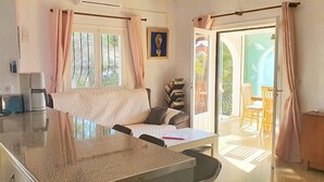 A room with a bed, a desk, a chair, a lamp, and a view of the outdoors. - villa CELINE  - Moraira (Moraira)