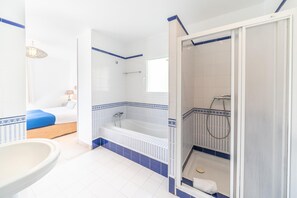 Bathtub, hair dryer, towels