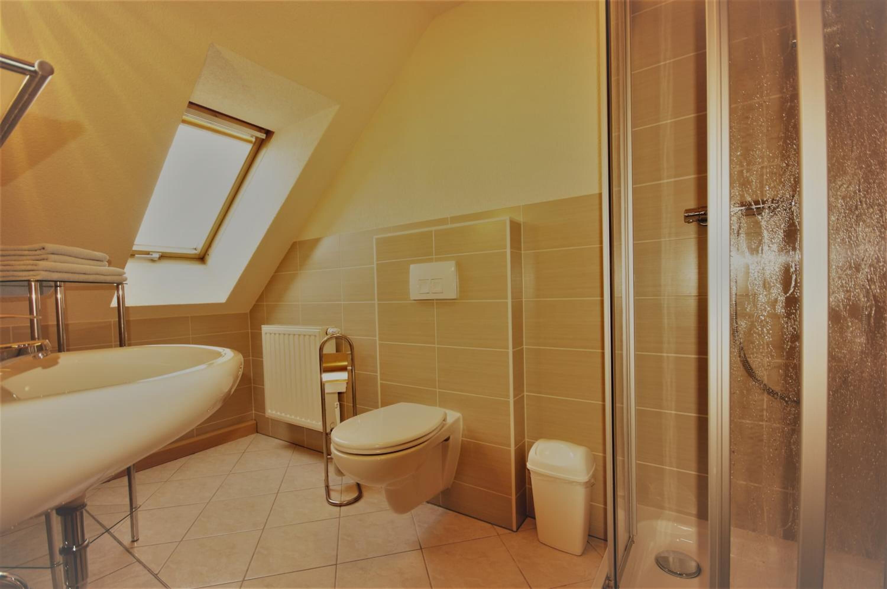 Shower, rainfall showerhead, hair dryer, towels
