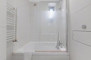 Combined shower/tub, hair dryer, towels, toilet paper
