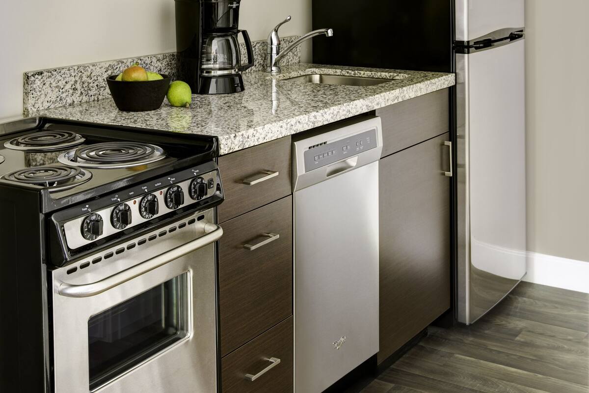 full-sized fridge, microwave, stovetop, dishwasher