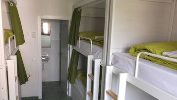 Family Room, Shared Bathroom (Bed in 6-Bed Dormitory) | Blackout drapes, free cribs/infant beds, free WiFi, bed sheets