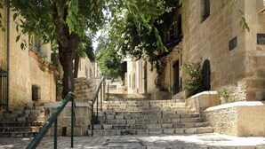 A stone staircase leading up to a building with a metal railing. - ibis Styles Jerusalem City Center - An AccorHotels Brand (Jerusalem)