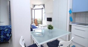 Enjoy a compact, modern space with a balcony offering a view, a flat-screen TV, and a small dining area.
