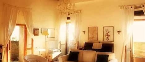 Televisio, DVD-soitin, kirjoja, videokirjasto