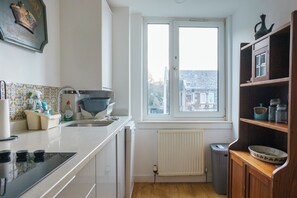 Fridge, microwave, cookware/dishes/utensils, dining tables