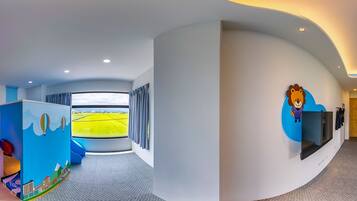 Family Quadruple Room, Garden View | Minibar, desk, blackout drapes, soundproofing