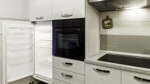 A kitchen with a built-in refrigerator, oven, and a stainless steel countertop. - IN FAIR 8: front fair, front fair elegant and comfortable residence (Bologna)