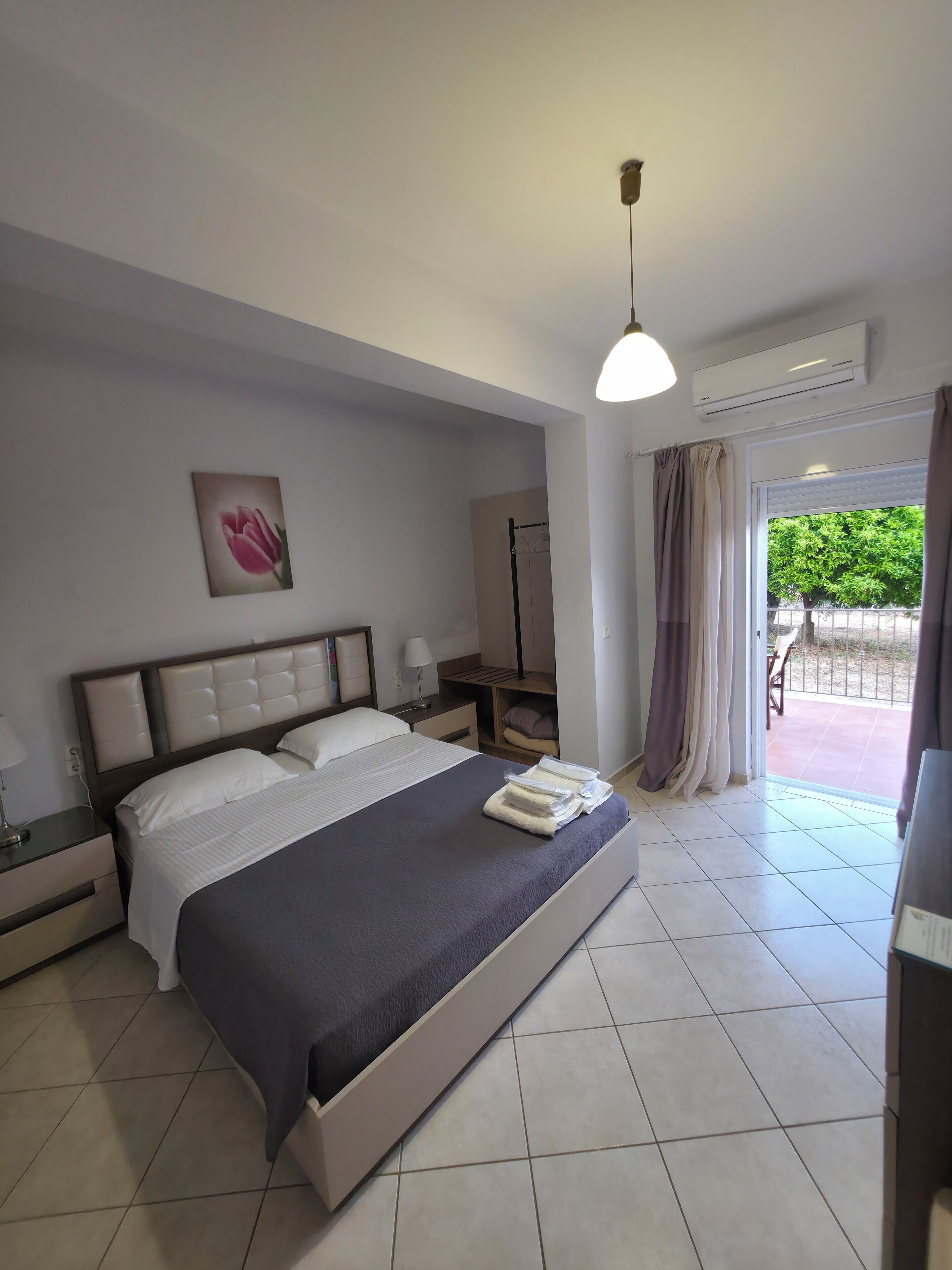 Basic Triple Room, 1 Queen Bed with Sofa bed | 2 bedrooms, in-room safe, individually decorated, individually furnished